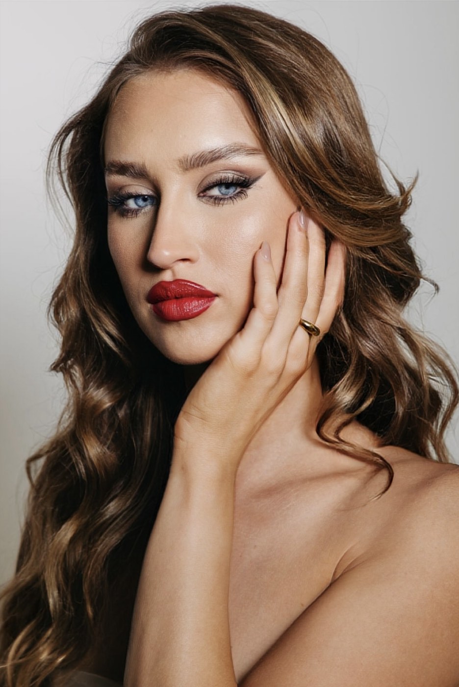 Beauty portrait of Shanti Griffin with a red lip and soft waves